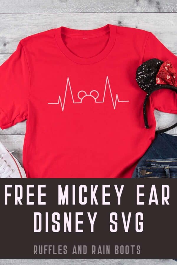 white Mickey Mouse heartbeat svg on red shirt with black and red Minnie ears and jeans on white wood background with text which reads free mickey ear disney svg from ruffles and rain boots