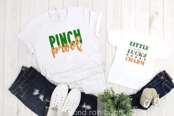 photo of two white shirts with pinch proof svg and little mister lucky charm cut files in orange green and gray on white background with jeans and shoes