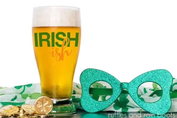 beer in glass with Irish-ish cut file and St Patricks Day decorations on wood table