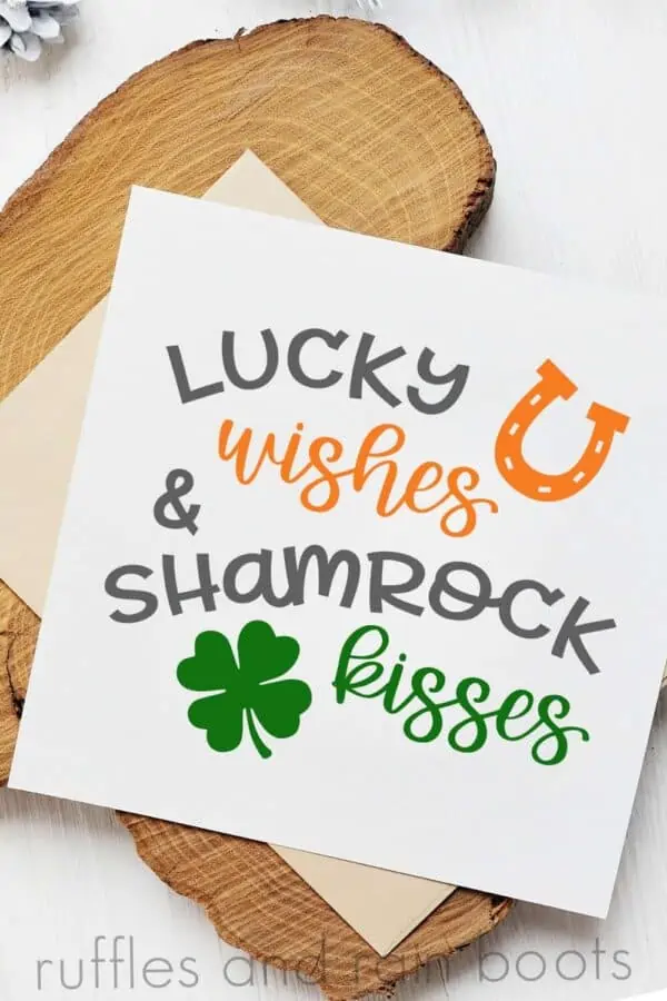 vertical image of a close up st patrick's day card with lucky wishes and shamrock kisses cut file