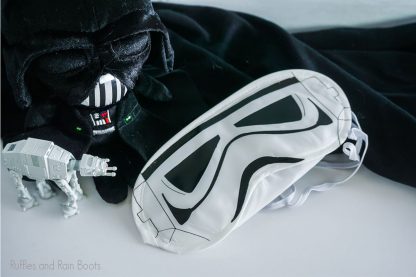 Stormtrooper eye mask on a table with star wars toys