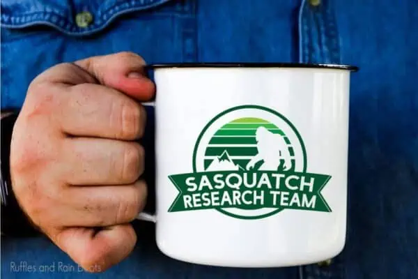 Sasquatch SVG for sublimation or infusible ink on a camp mug held by a hand