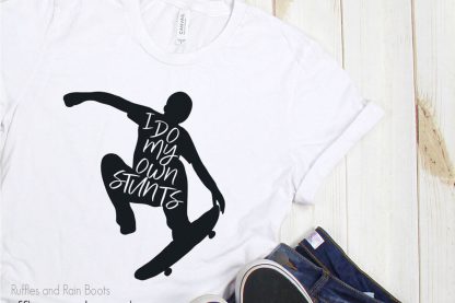I do my own stunts skateboard cut file set on a t-shirt laying on a table
