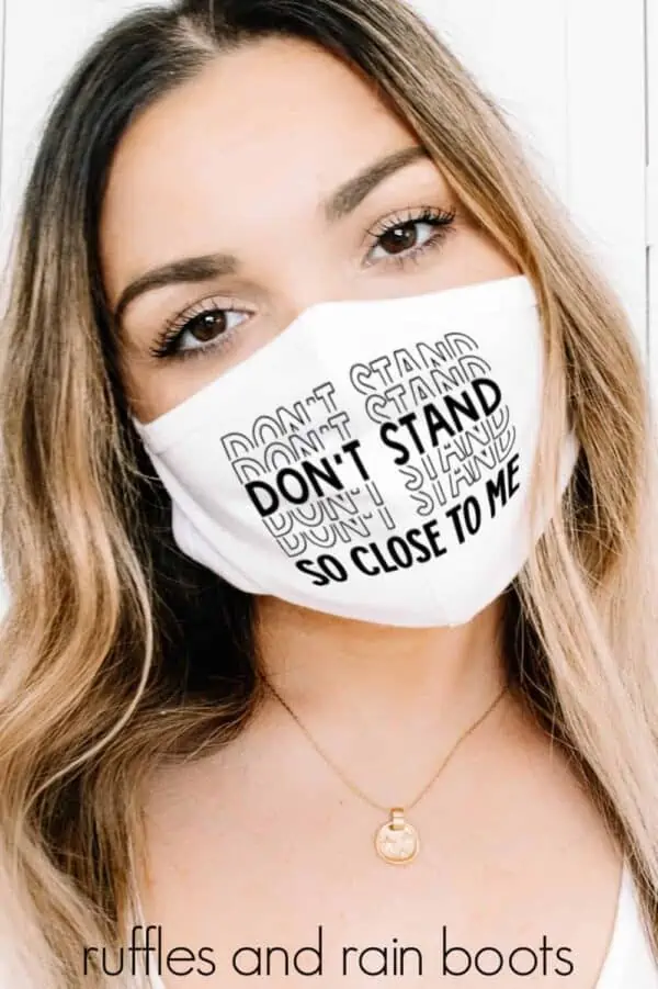 beautiful woman in white face mask with the words don't stand so close to me on it
