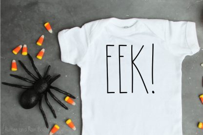 EEK halloween SVG cut file set For cricut or silhouette on a t-shirt with candy corn on a table