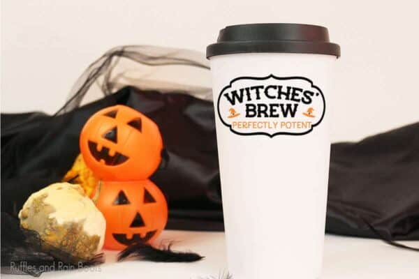 Wiches' brew cut file set on a tumbler sitting on a table with halloween decorations