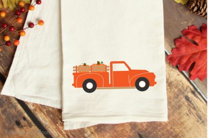 fall farm truck SVG cut file for cricut or silhouette on a kitchen towel on a table