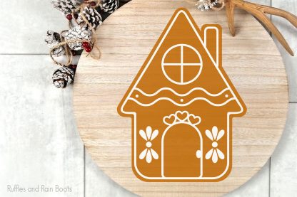skinny gingerbread house cut file for cutting machines on a wood round sign