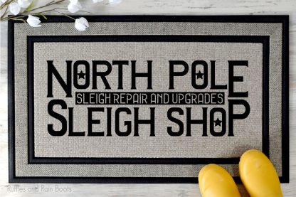 north pole sleigh shop SVG file set on a welcome mat