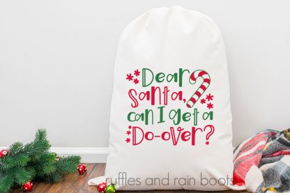 horizontal image of Dear Santa cut file for Cricut and Silhouette featured on a white gift bag
