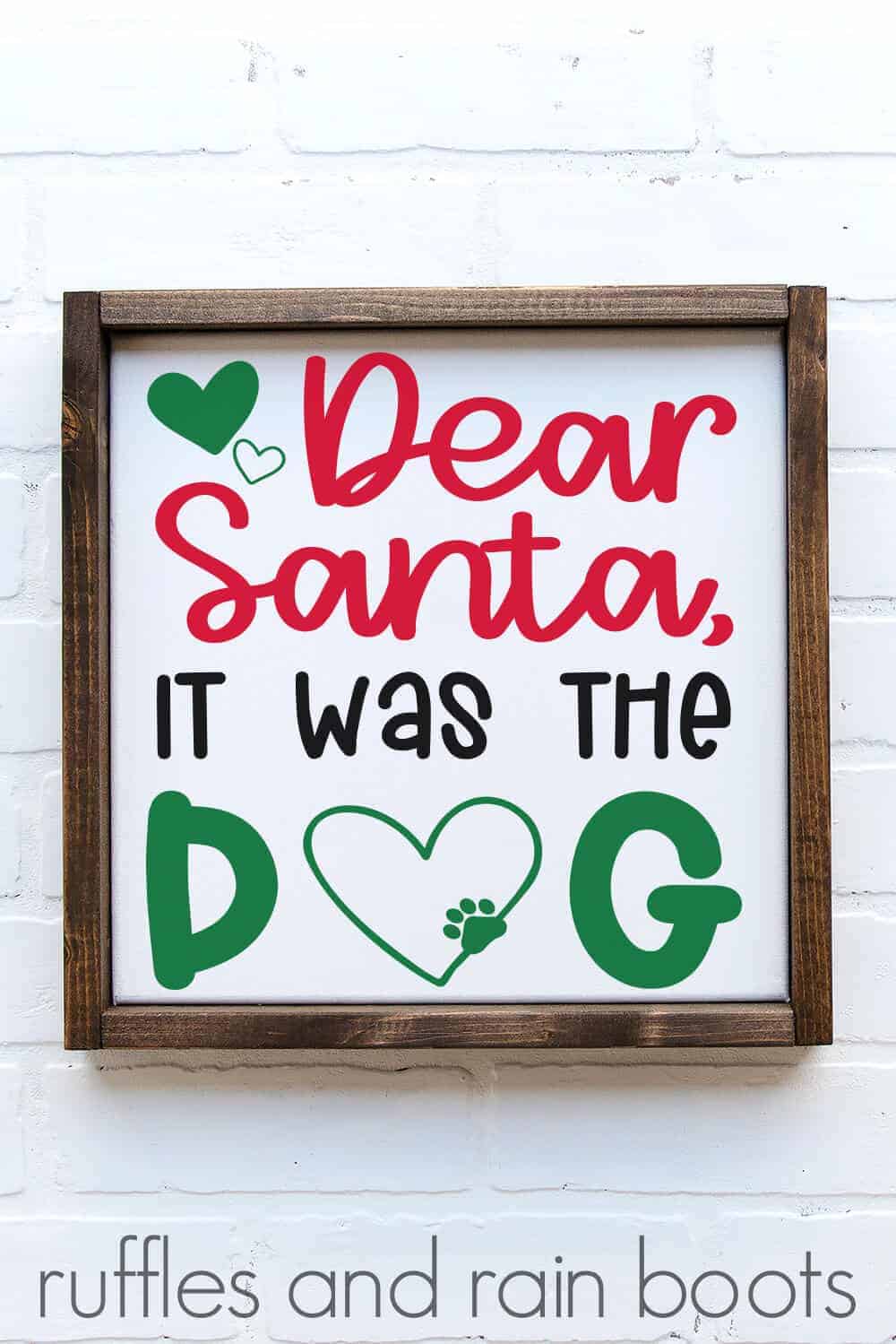 vertical image of white frame on brick background with red green and black design which says Dear Santa It was the dog