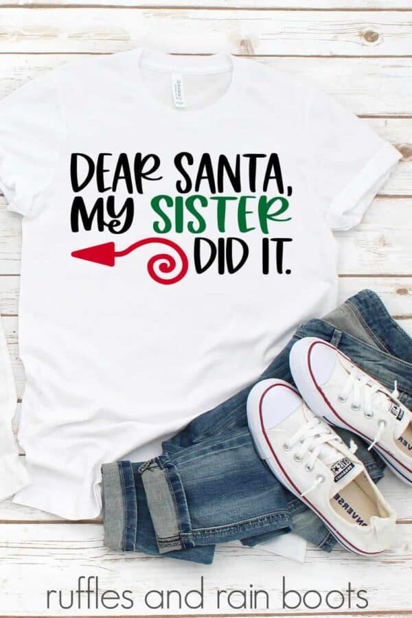 playful dear Santa cut file on white t shirt with wood background tennis shoes and jeans