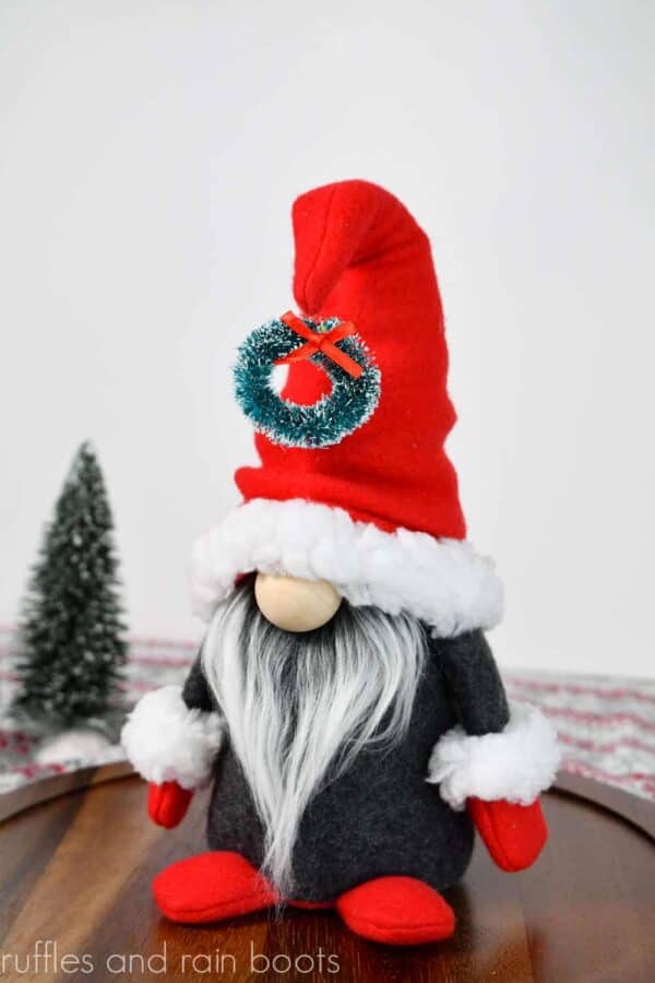 Christmas gnome pattern in gray and red on white background