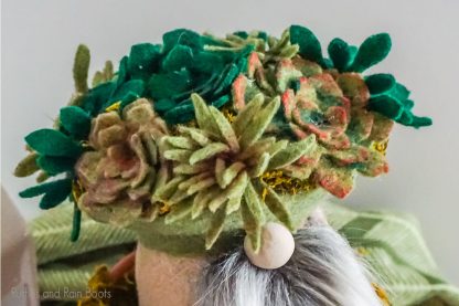 diy gnome with faux succulent cut files made into felt succulents on it's hat