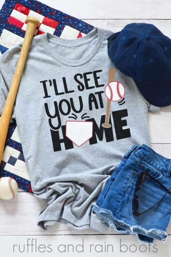 vertical image of vinyl on gray t shirt with baseball svg of ill see you at home base