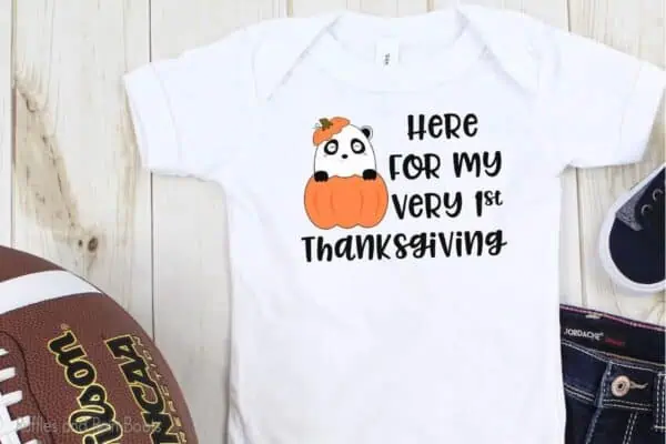 onesie with cut first thanksgiving cut file set with a panda in a pumpkin