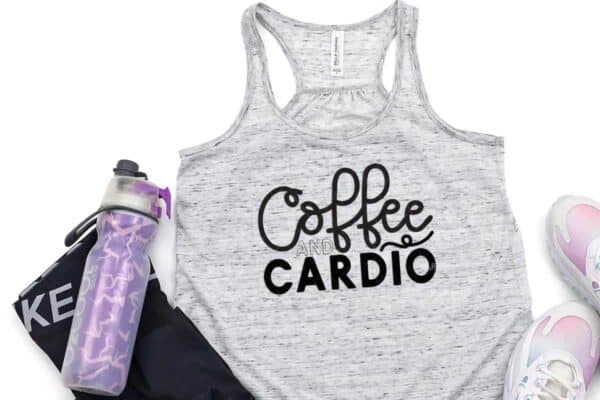horizontal image with purple water bottle black workout leggings and tennis shoes with coffee and cardio in black vinyl on workout tank on white background