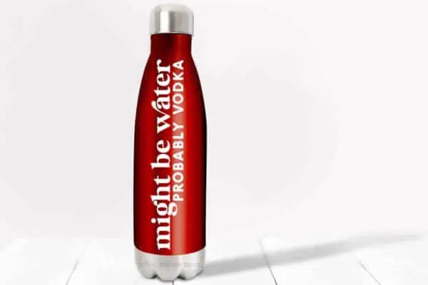 Horizontal image of red water bottle with white vinyl which reads might be water probably vodka.