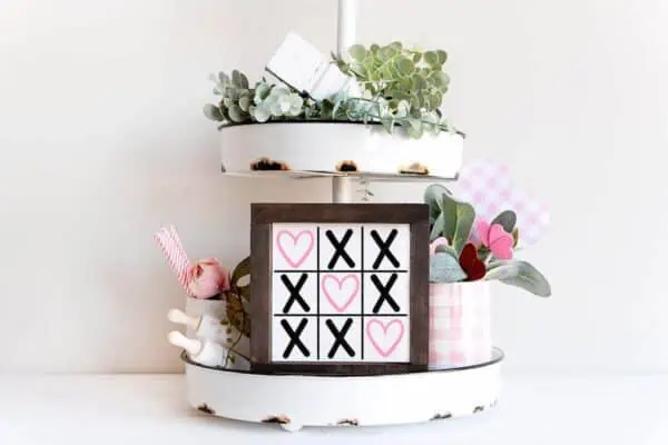 Horizontal image of tiered tray with heart SVG free tic tac toe Cricut and Silhouette cut file.