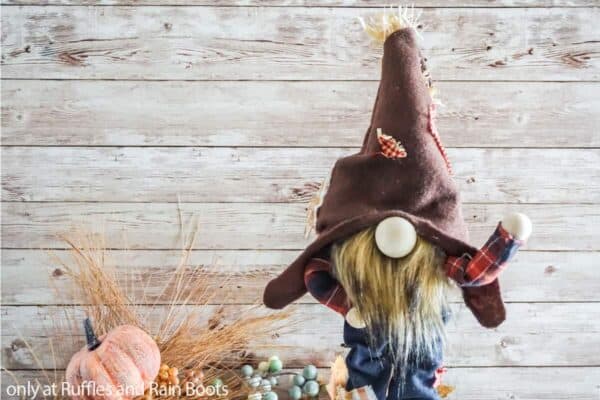 Horizontal image of standing scarecrow gnome with posable gnome arms and legs.