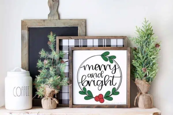 Horizontal image of Christmas sign which reads Merry and Bright surrounded in holly.