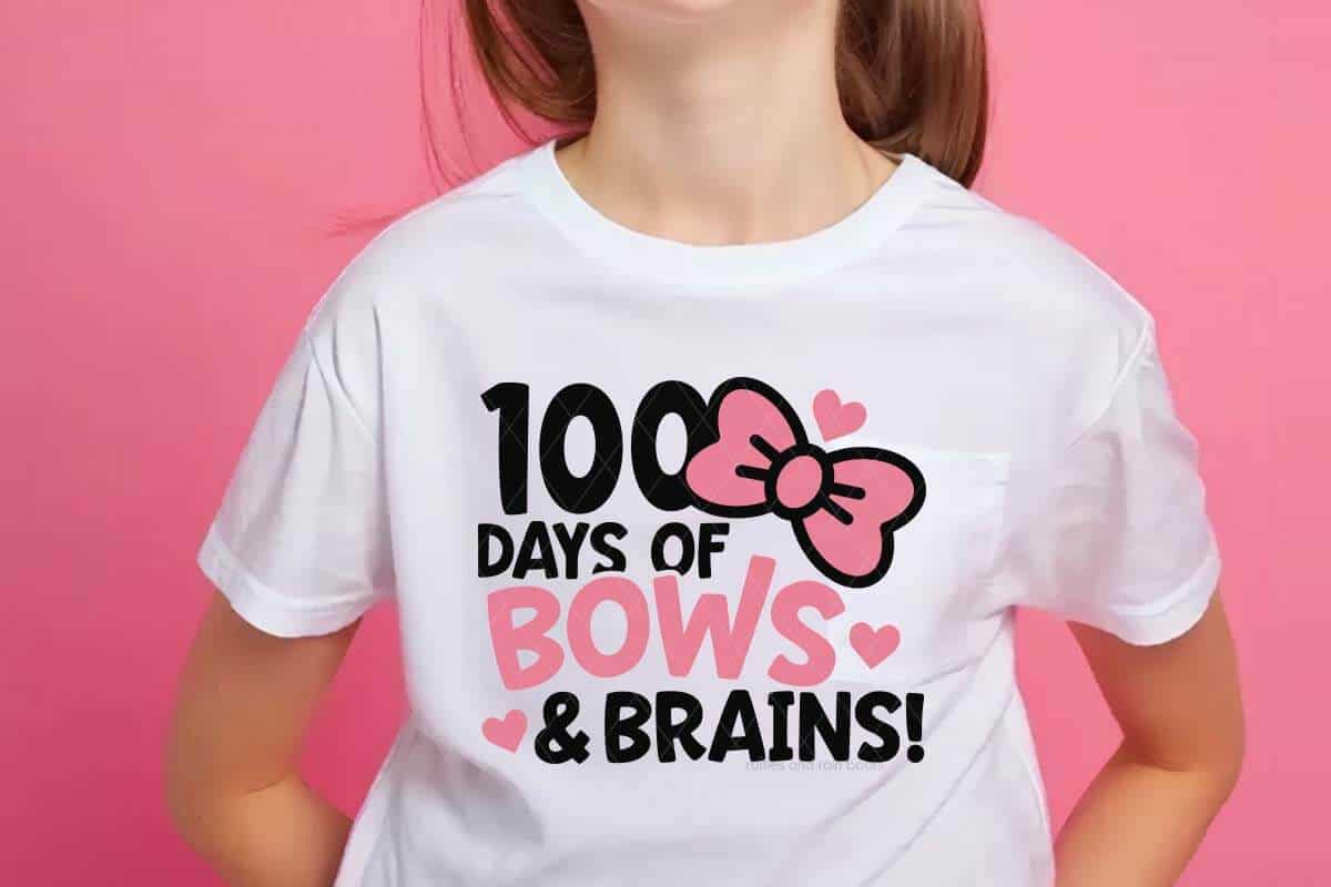 Horizontal image of pink background and girl in white t-shirt which reads 100 days of bows and brains for 100 days of school.