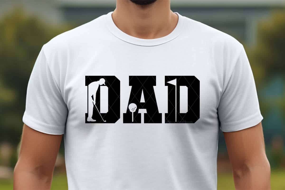 Horizontal image of a man in a white shirt which reads DAD with a golfer, ball, and flag siilhouette.