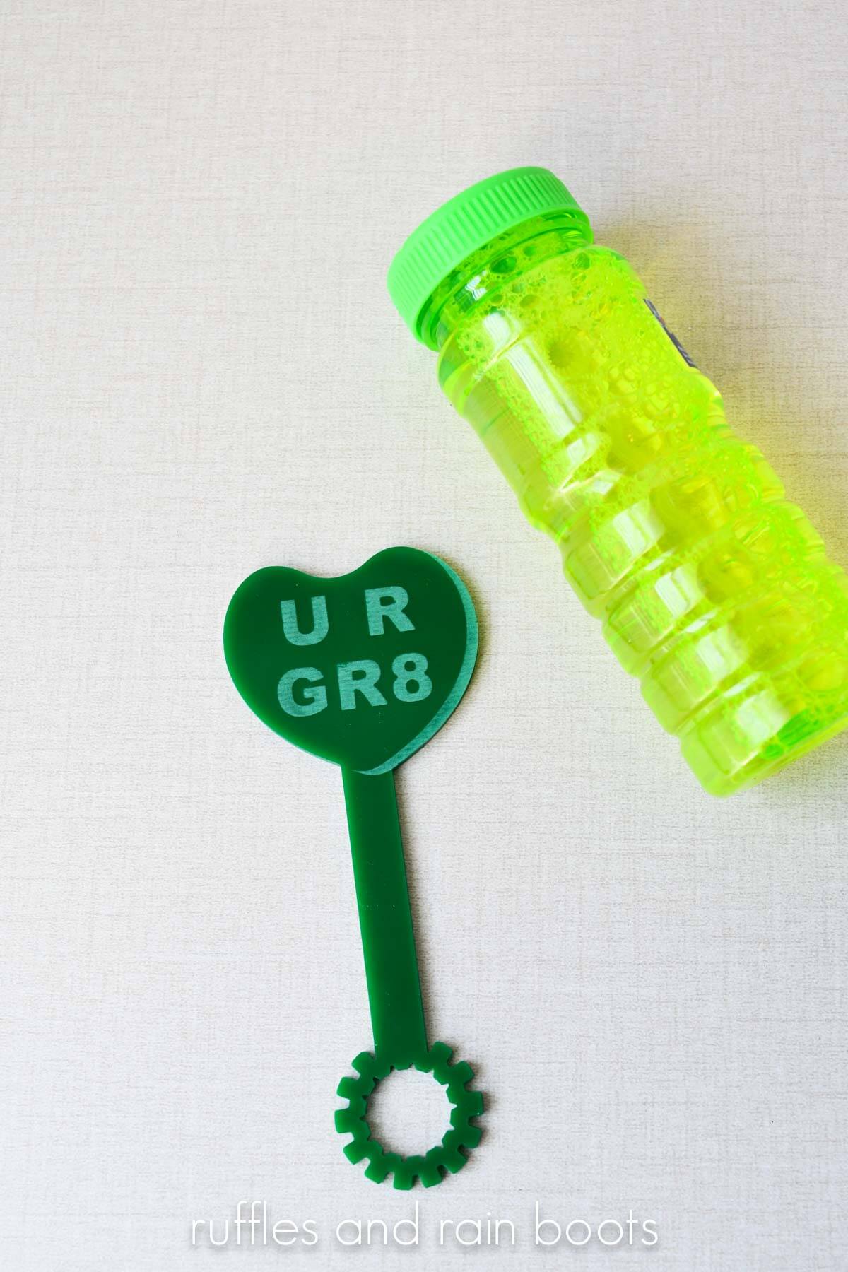 Sweetheart bubble wand for Valentine's Day with a green jar of bubbles.