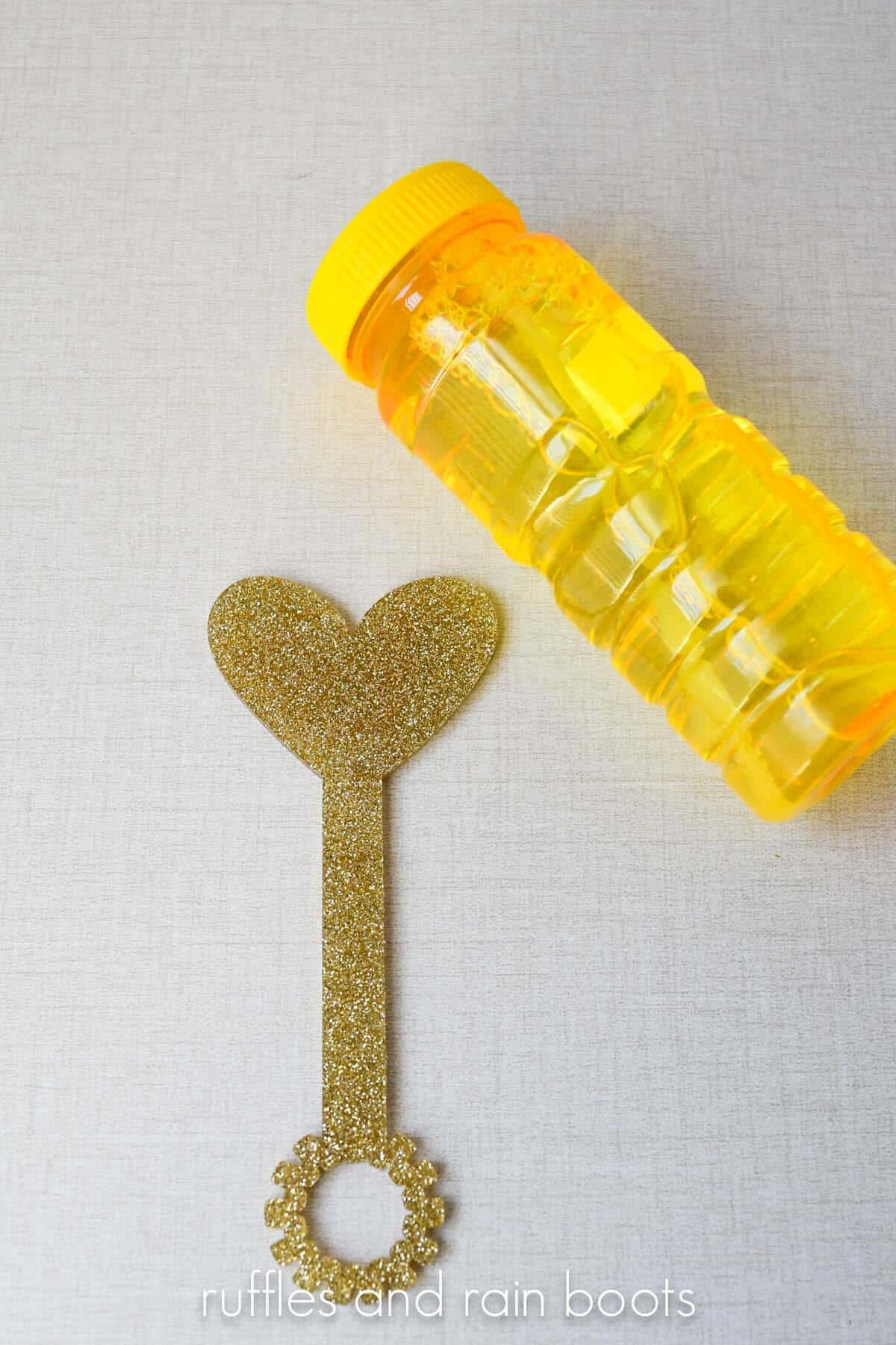 Heart bubble wand for Valentine's Day with a yellow jar of bubbles.