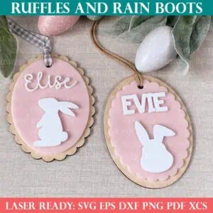 Square, close up image of two pink, white, and wood Easter basket tags on a linen background from Ruffles and Rain Boots laser SVG.