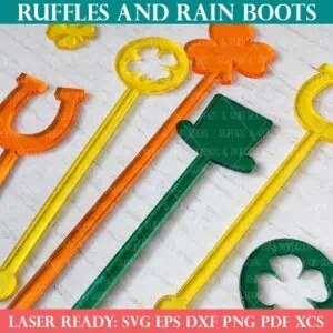 Close up product image of yellow, orange, and green translucent acrylic St Patrick's Day stir sticks on white wood table.