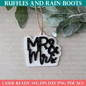 Close up image of a white and black mr and mrs ornament laser cut wedding gift tag.
